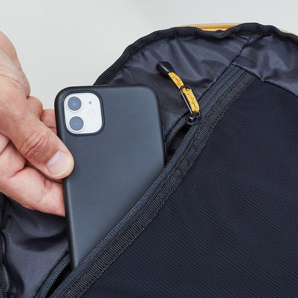 Close up view of internal security pocket with mobile being placed in pocket