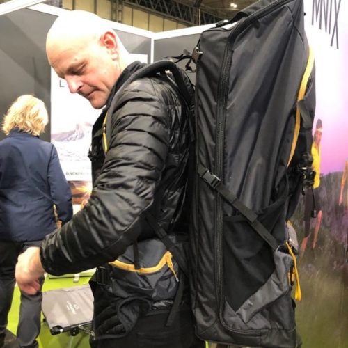Man trying on LayBakPak backpack at National Outdoor Expo