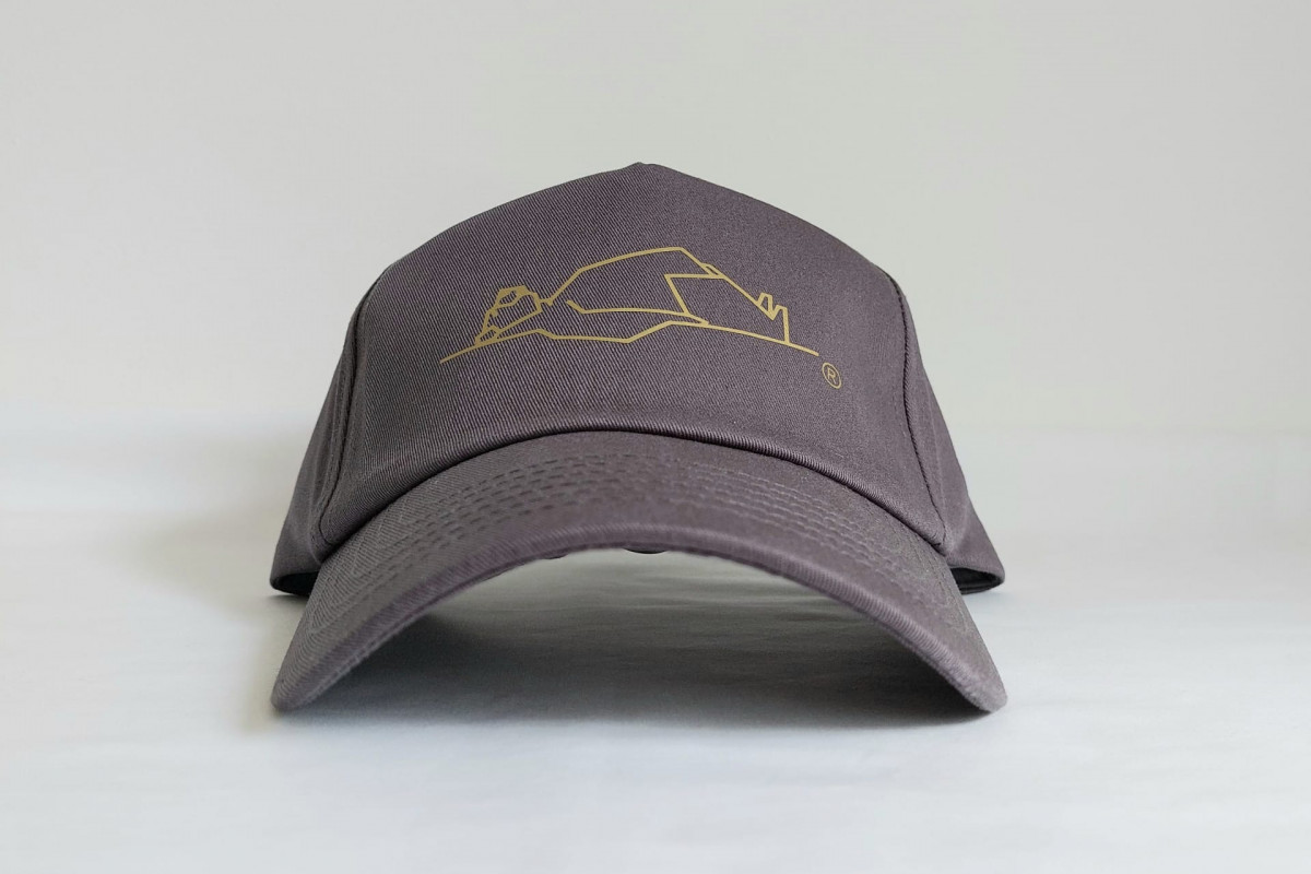Front view of LayBakPak cap showing bear image from logo