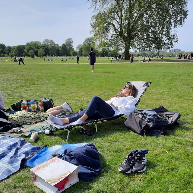 Girl relaxing on LayBakPak lounger in London park